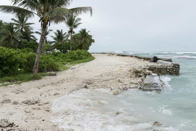 A broken sea wall on Tarawa Island, where the rising ocean is slowly encroaching on their community.