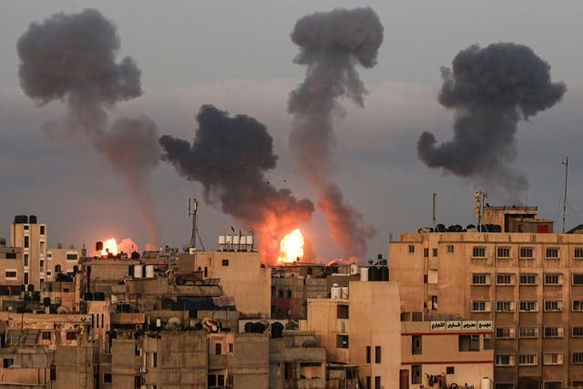 Explosions are seen over Gaza City in this photograph from Tuesday
