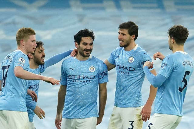 Manchester City players celebrate en route to the 2020/21 Premier League title