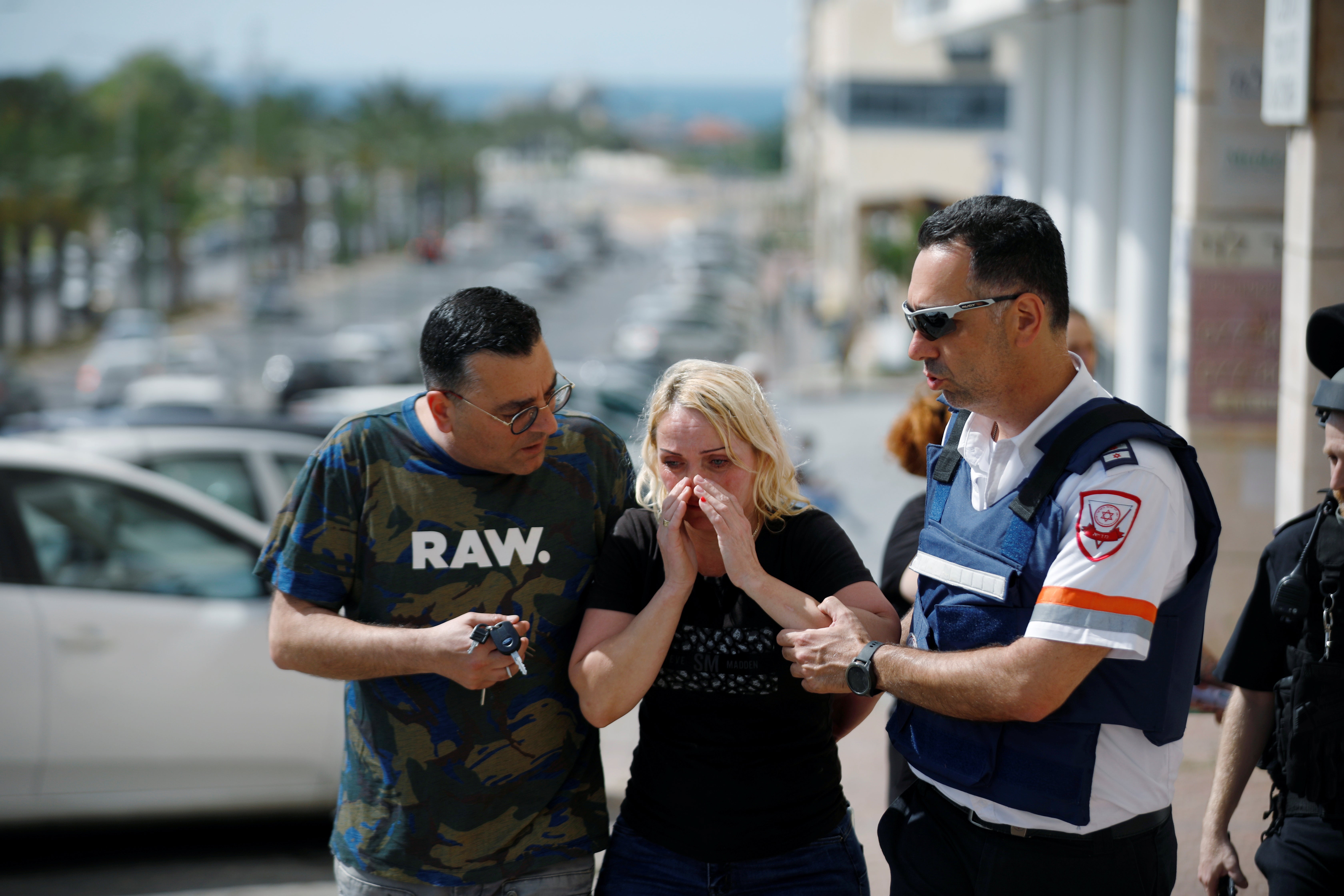 A woman in Ashkelon at the scene of a rocket attack