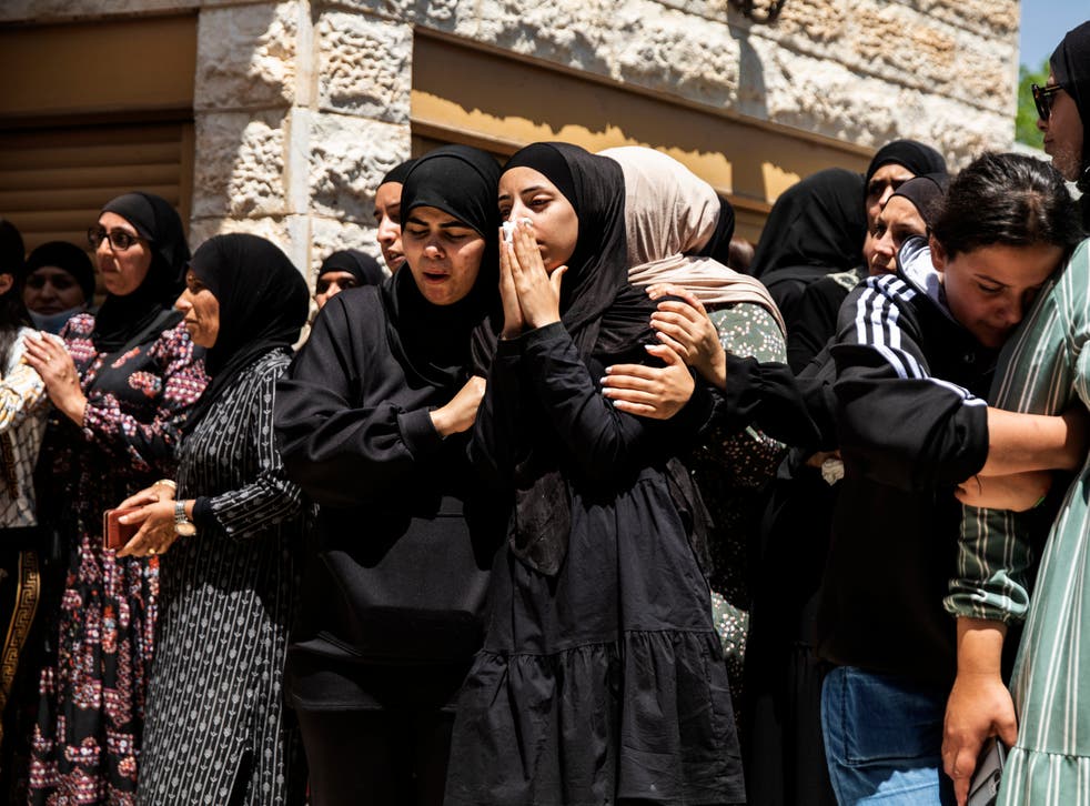 <p>Mourners attend the funeral of Israeli Arab Khalil Awaad and his daughter Nadine, 16, in the village of Dahmash near the Israeli city of Lod</p>