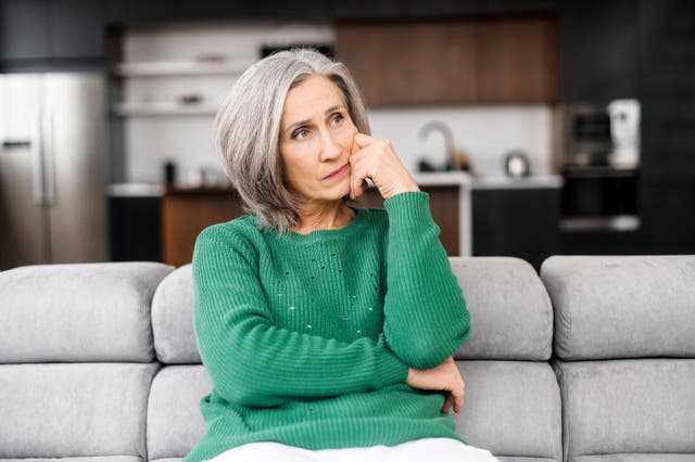 Middle-aged woman mulling things over