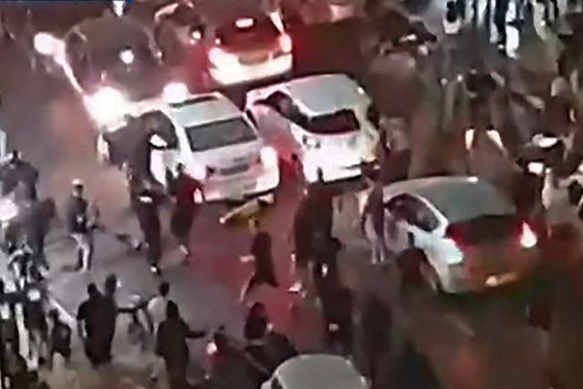 A far-right Israeli mob have attacked a man they believed to be an Arab, dragging him from his car and beating him unconscious