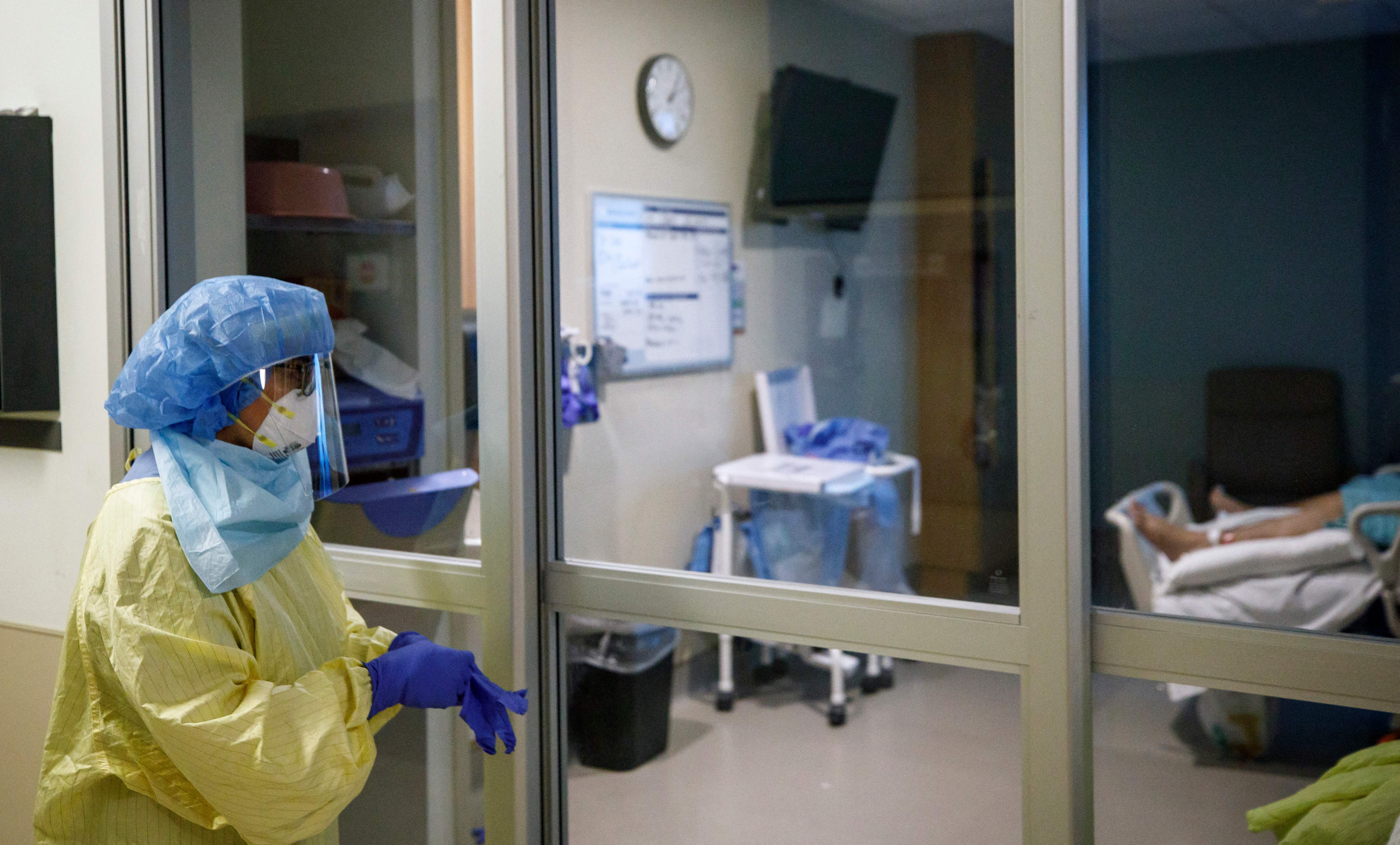 Representative: A healthcare worker looks into transfer a patient from Humber River Hospital's Intensive Care Unit to a waiting air ambulance as the hospital frees up space In their ICU unit, in Toronto, Ontario, Canada, on 28 April 2021