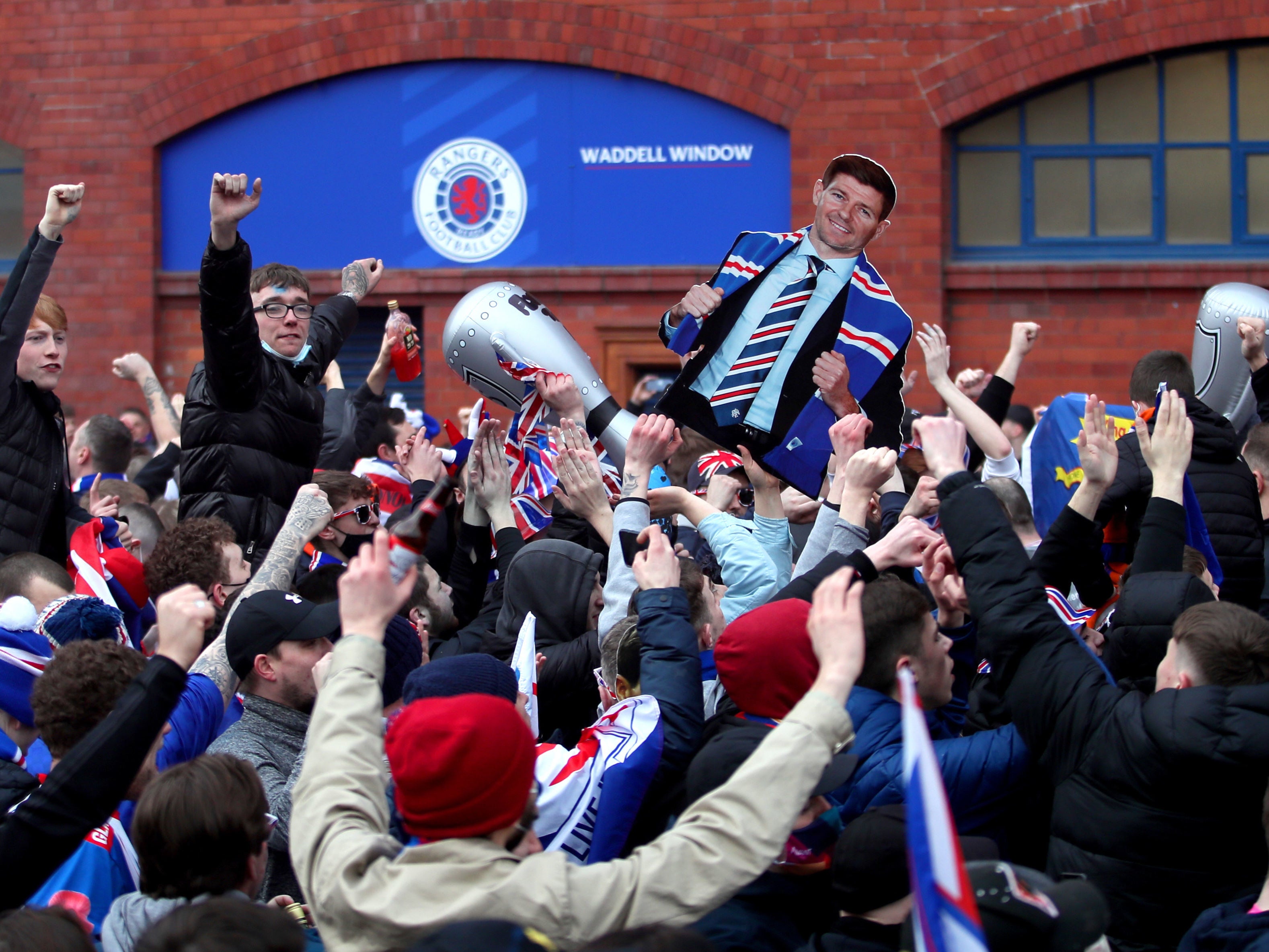 Rangers fans celebrate winning the Scottish title in March