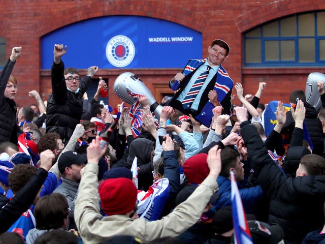 Rangers fans celebrate winning the Scottish title in March