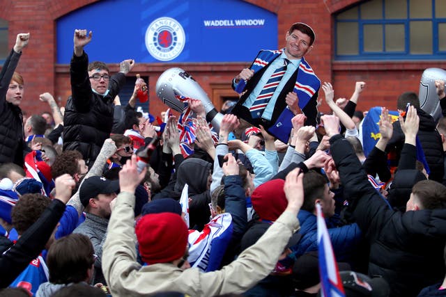 Rangers fans celebrate winning the Scottish title in March