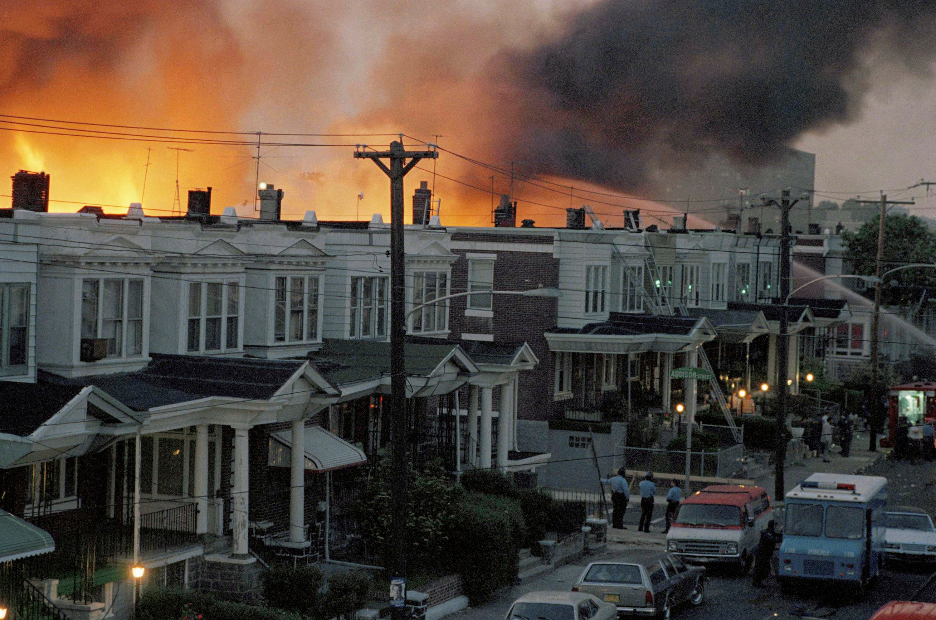 Scores of row houses in Philadelphia burned and 11 people were killed after police dropped two bombs on a home belonging to radical Black liberation organisation MOVE on 13 May, 1985.