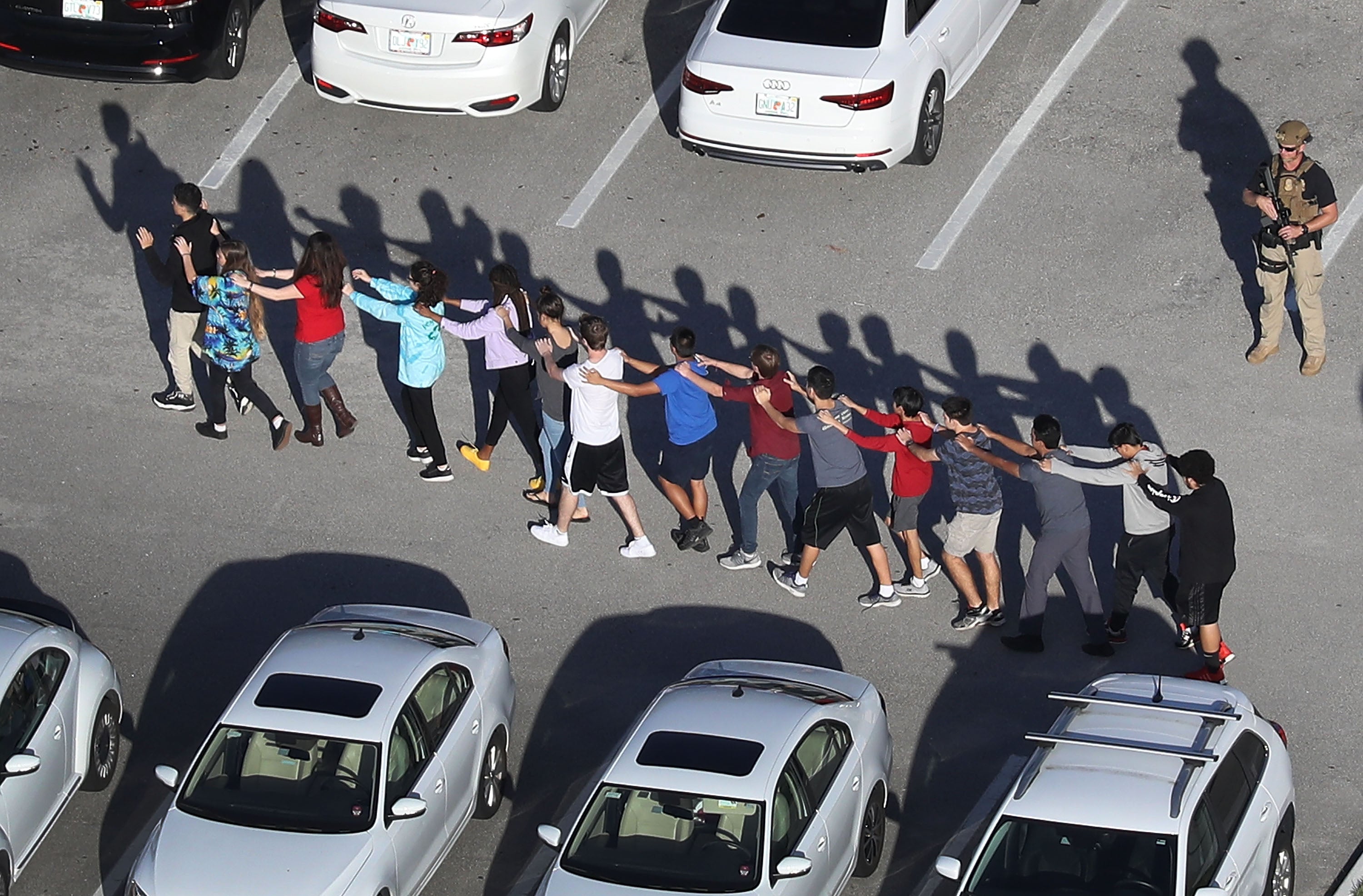 Students walking out of Marjory Stoneman Douglas High School in Parkland, Florida, following the mass shooting on Valentine’s Day in 2018