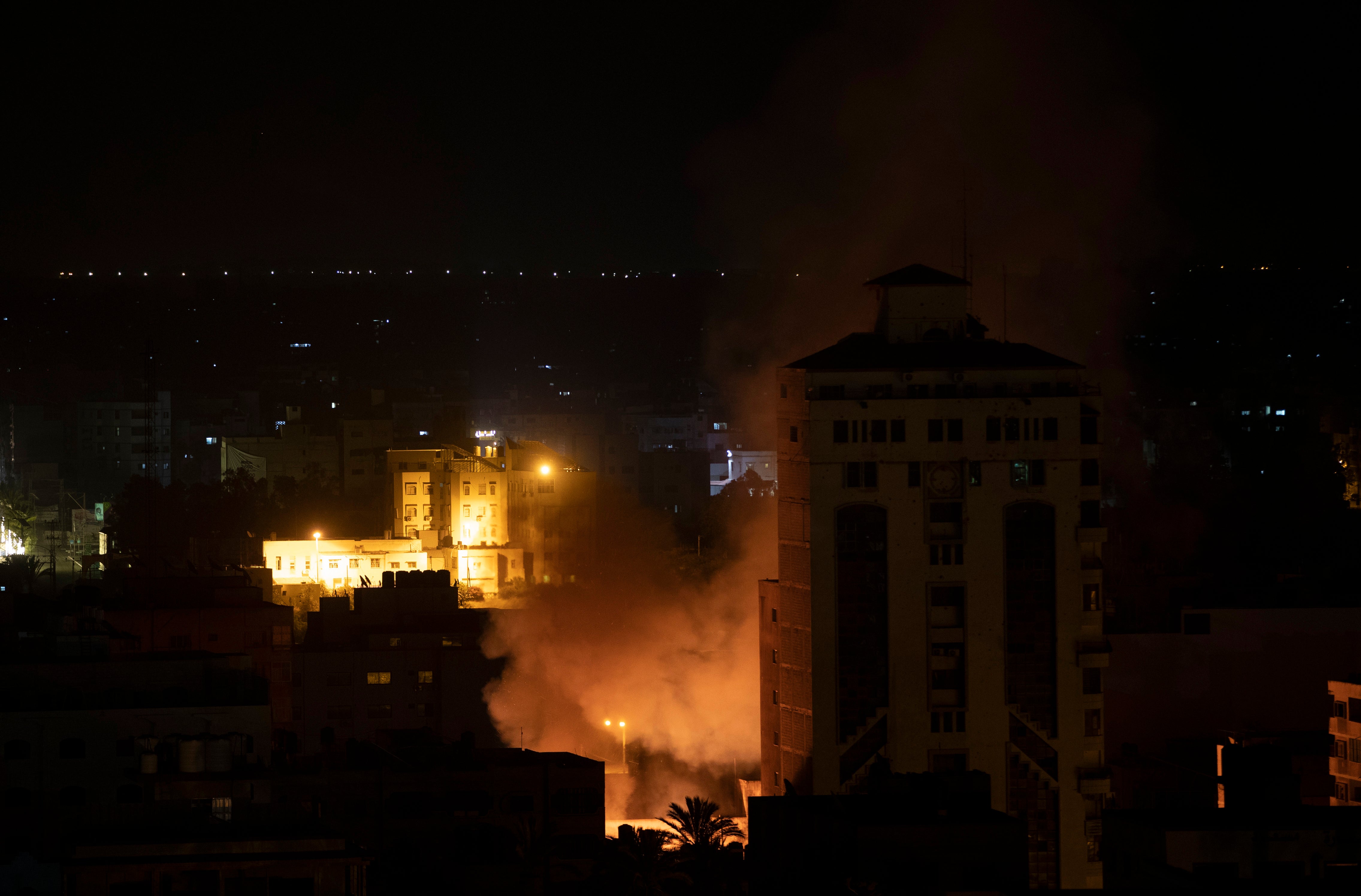 Smoke billows from a burning high-rise building in Gaza City following an Israeli airstrike
