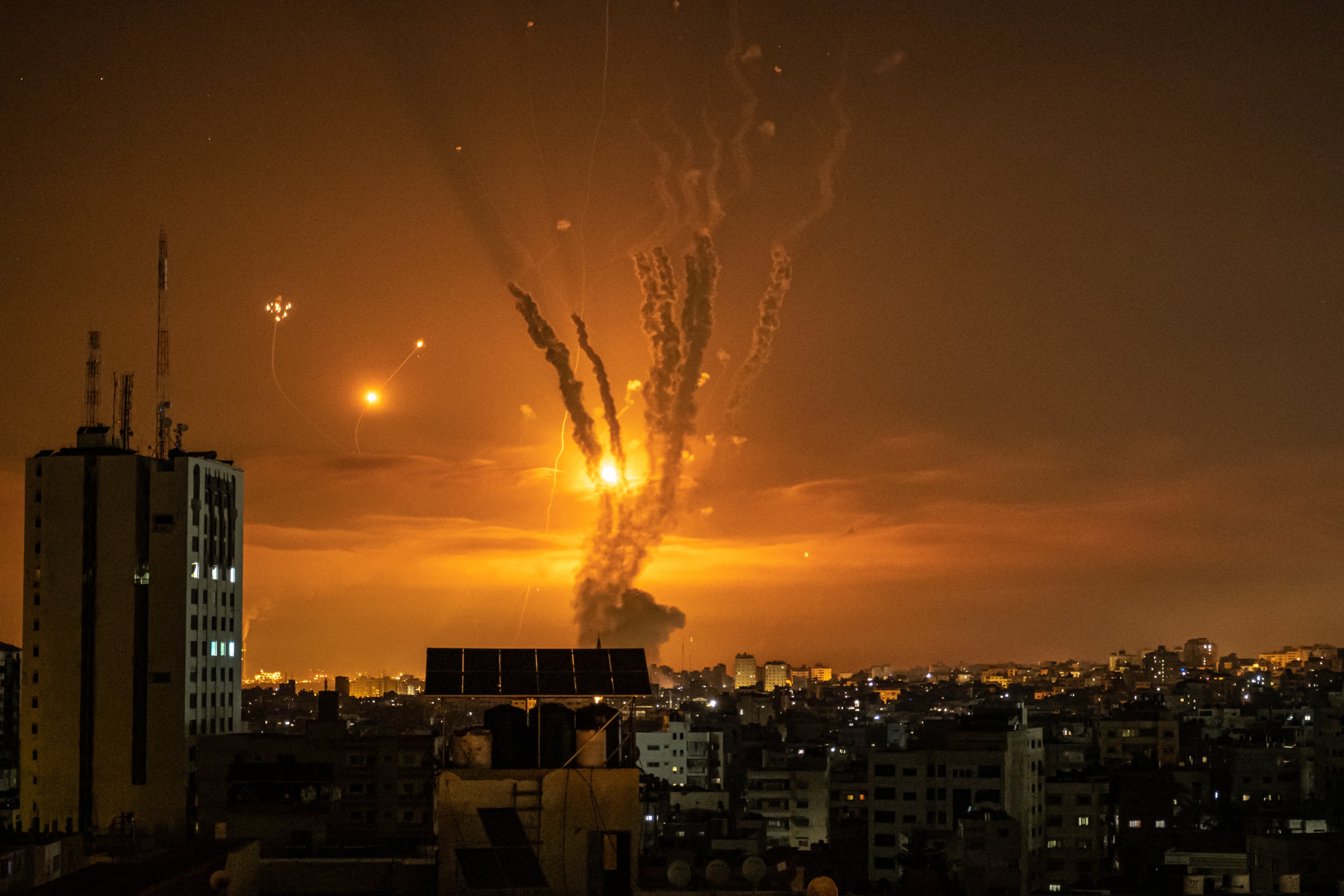 Rockets launched towards Israel from the northern Gaza Strip and a response from the Israeli missile defense system known as the Iron Dome leave streaks through the sky over Gaza City