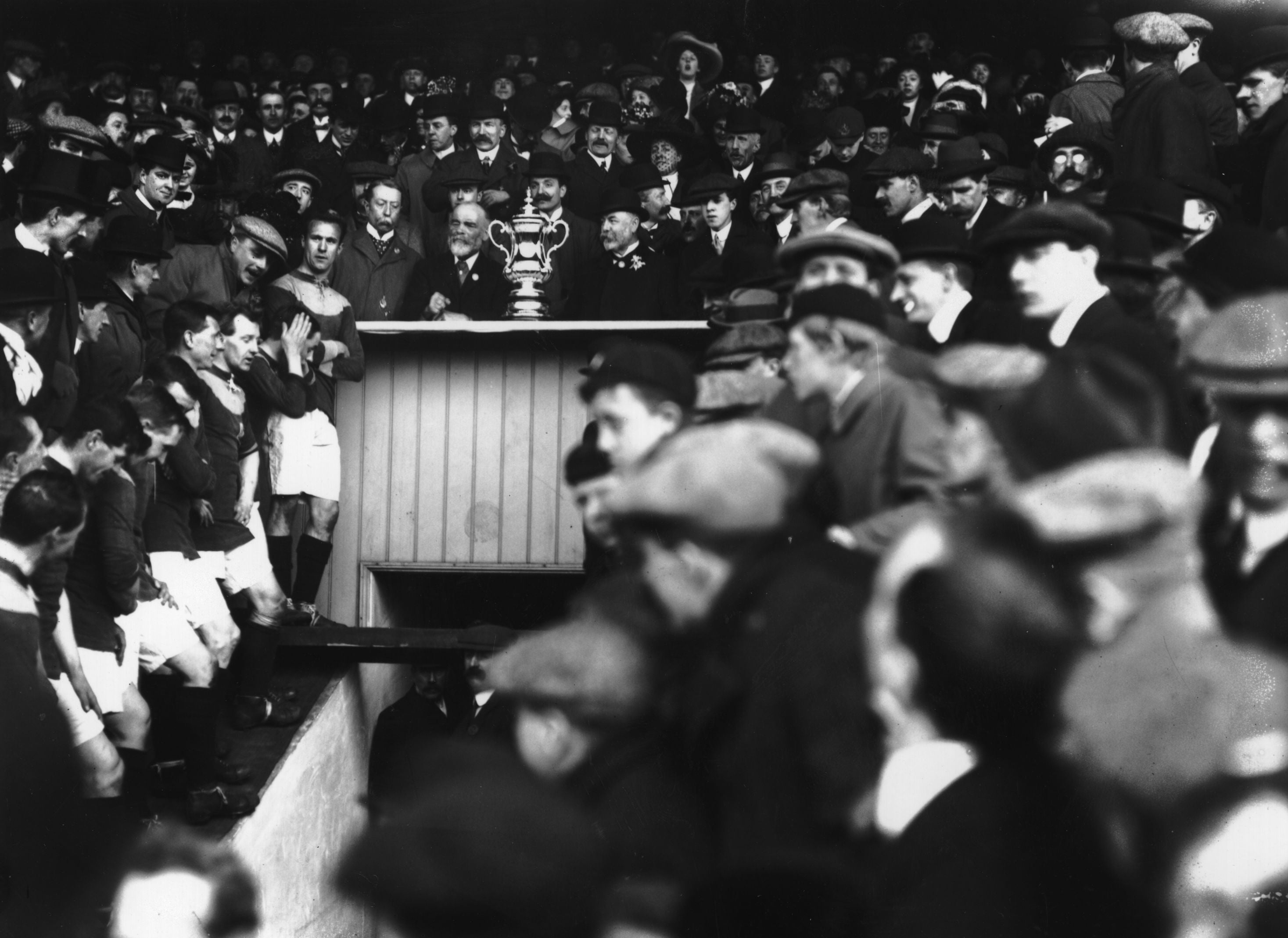 Bradford’s players await the FA Cup trophy presentation in 1911