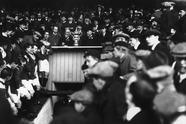 Bradford’s players await the FA Cup trophy presentation in 1911