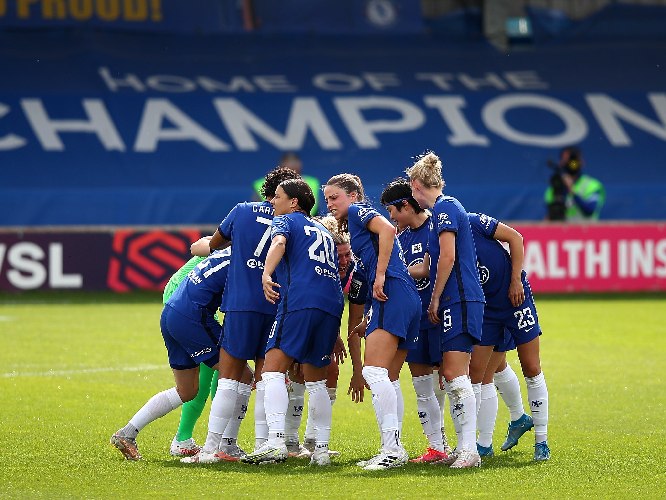 Chelsea players huddle before a game