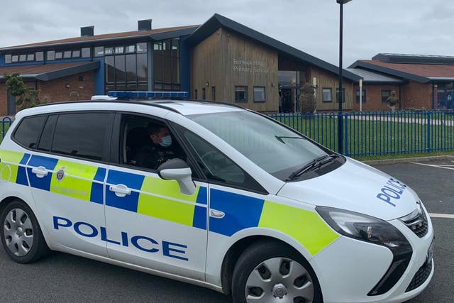 Police were called to the school as men with weapons entered the grounds