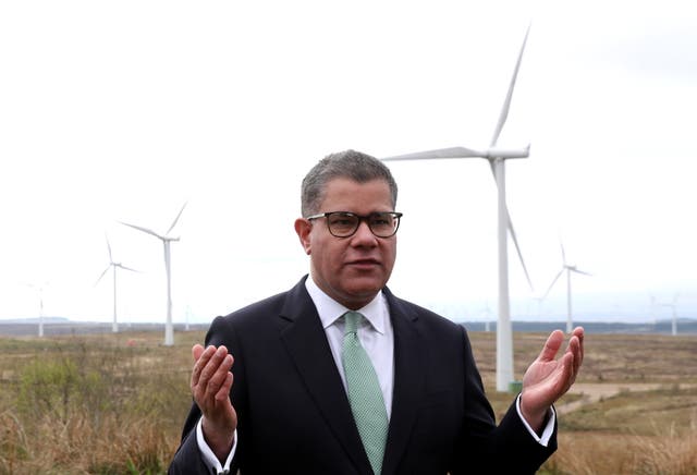<p>Alok Sharma called on the world to abandon coal while standing in front of Whitelee Windfarm in Glasgow on Friday</p>