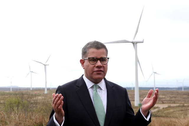 <p>Alok Sharma called on the world to abandon coal while standing in front of Whitelee Windfarm in Glasgow on Friday</p>