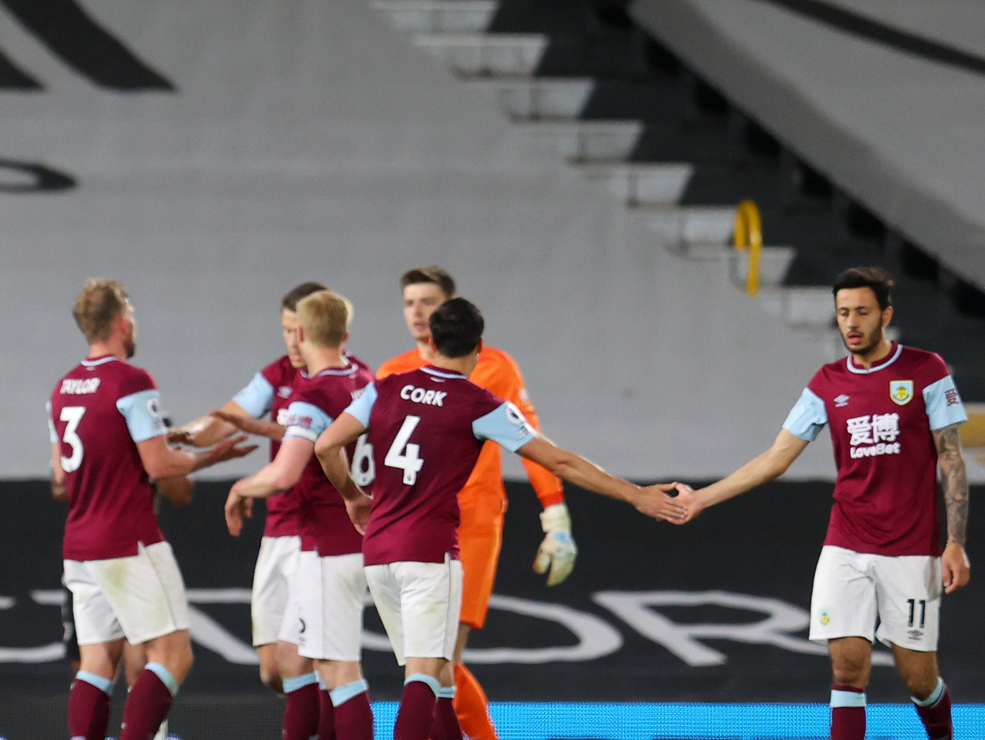 Burnley players celebrate their win over Fulham last time out