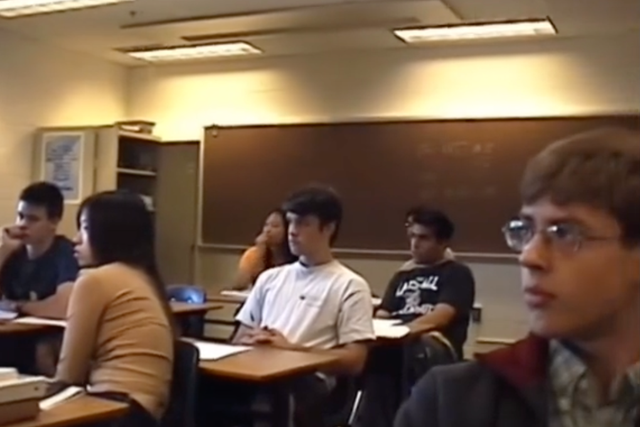 <p>Virginia high school students listen in silence to a news broadcast on 11 September, 2001</p>