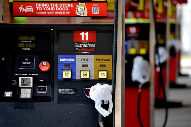 <p>In this May 11, 2021 file photo, a QuickTrip convenience store has bags on their pumps as the station has no gas, in Kennesaw, Ga. Following the attack on the Colonial Pipeline on March 12 many gas stations began to run low in the US</p>