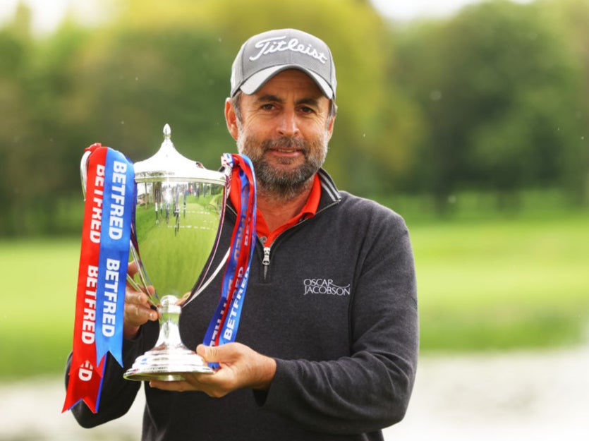 <p>Richard Bland poses with the trophy</p>