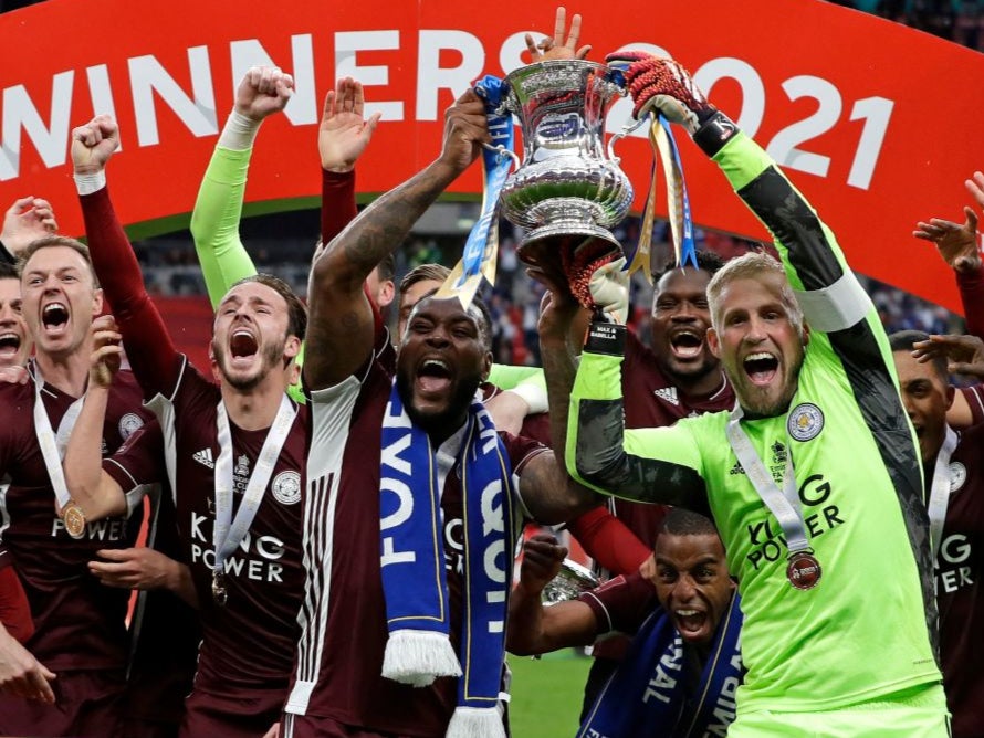 <p>Leicester lift the trophy at Wembley</p>