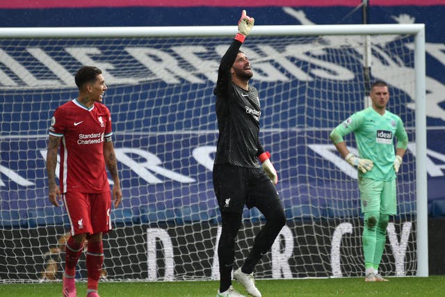 <p>Alisson celebrates scoring Liverpool’s winning goal</p>