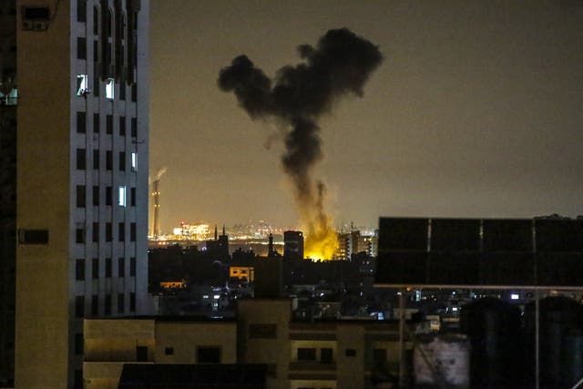 Smoke rises after an Israeli air strike hits in Gaza City