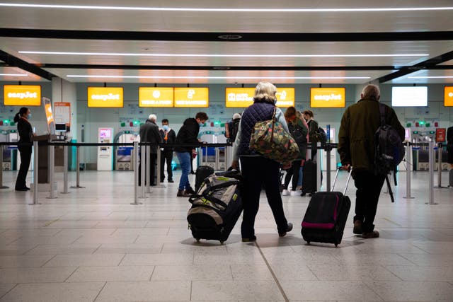 <p>All aboard: Passengers check in for the first holiday and leisure flights from Gatwick Airport, as easyJet relaunches flights from the UK to green-list destinations </p>