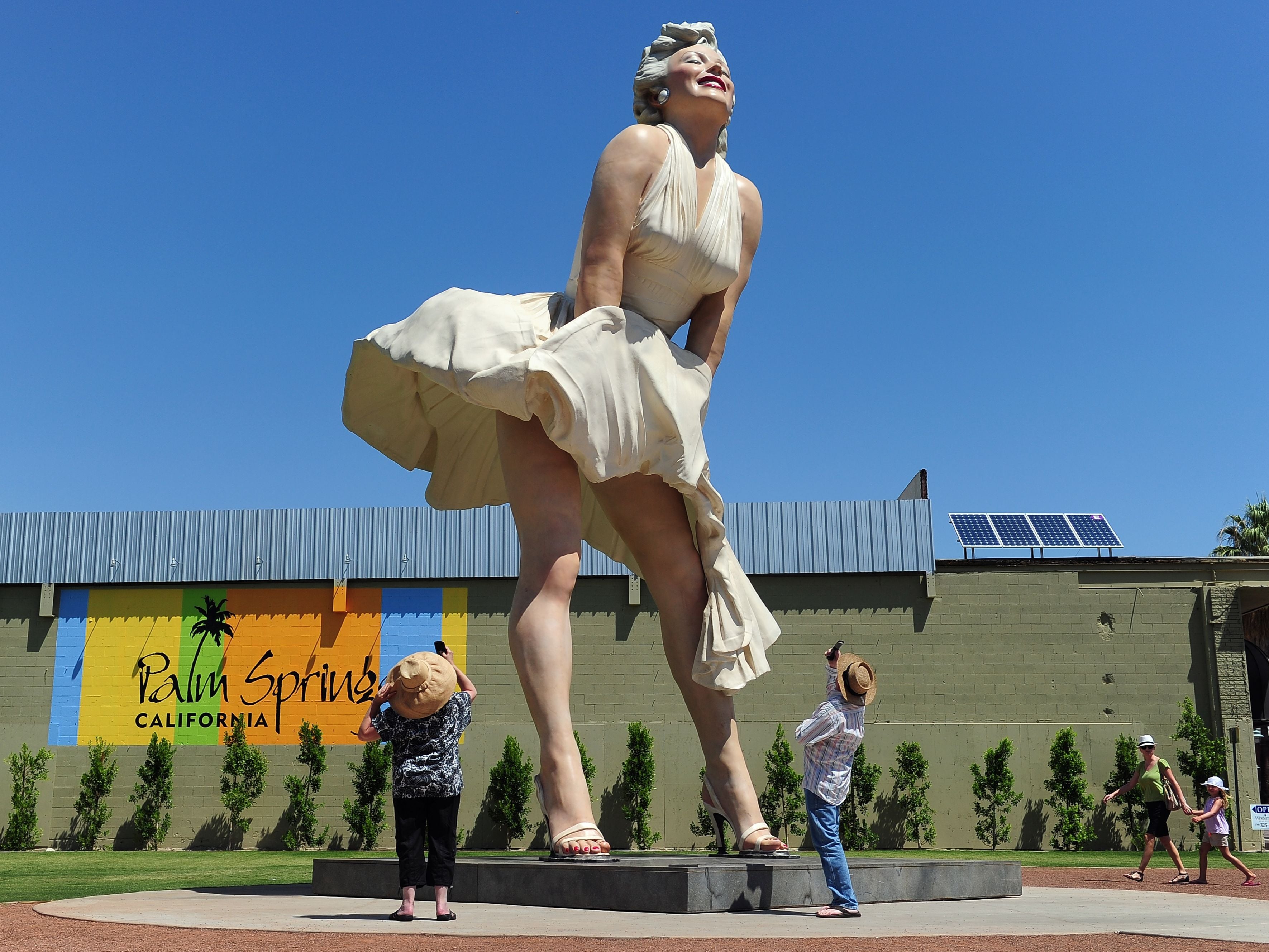 People visit and photograph the ‘Forever Marilyn’ statue of actress Marilyn Monroe in Palm Springs, California, on 4 August 2012
