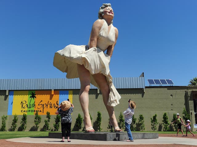 <p>People visit and photograph the ‘Forever Marilyn’ statue of actress Marilyn Monroe in Palm Springs, California, on 4 August 2012</p>