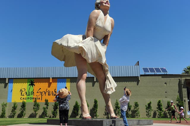 <p>People visit and photograph the ‘Forever Marilyn’ statue of actress Marilyn Monroe in Palm Springs, California, on 4 August 2012</p>