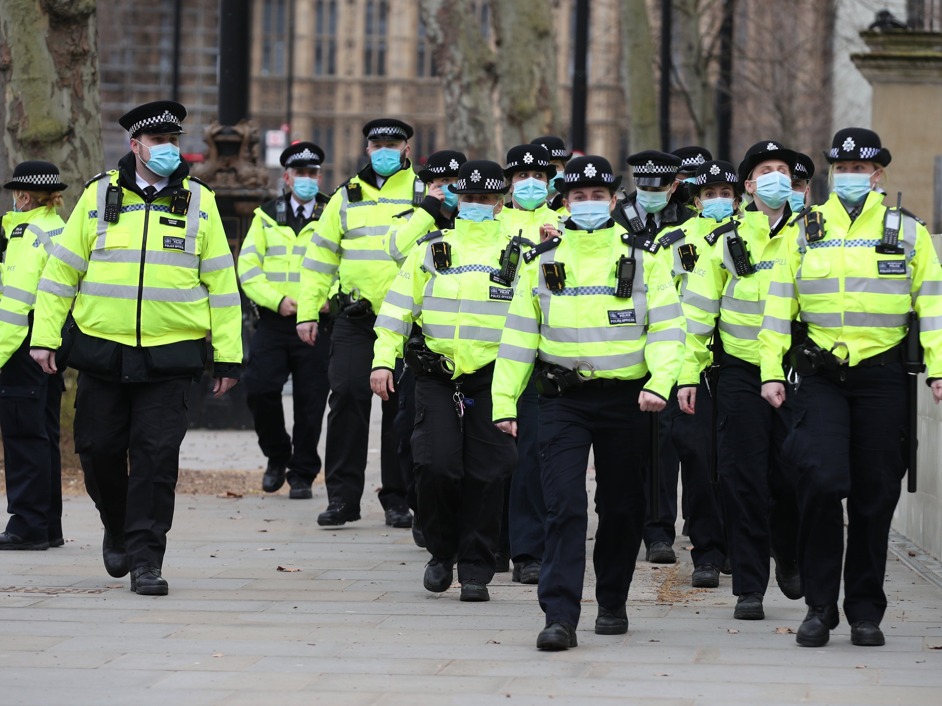 Officers patrol outside New Scotland Yard in London as members of the public gathered for a protest following clashes between police and crowds at a vigil for Sarah Everard on Clapham Common