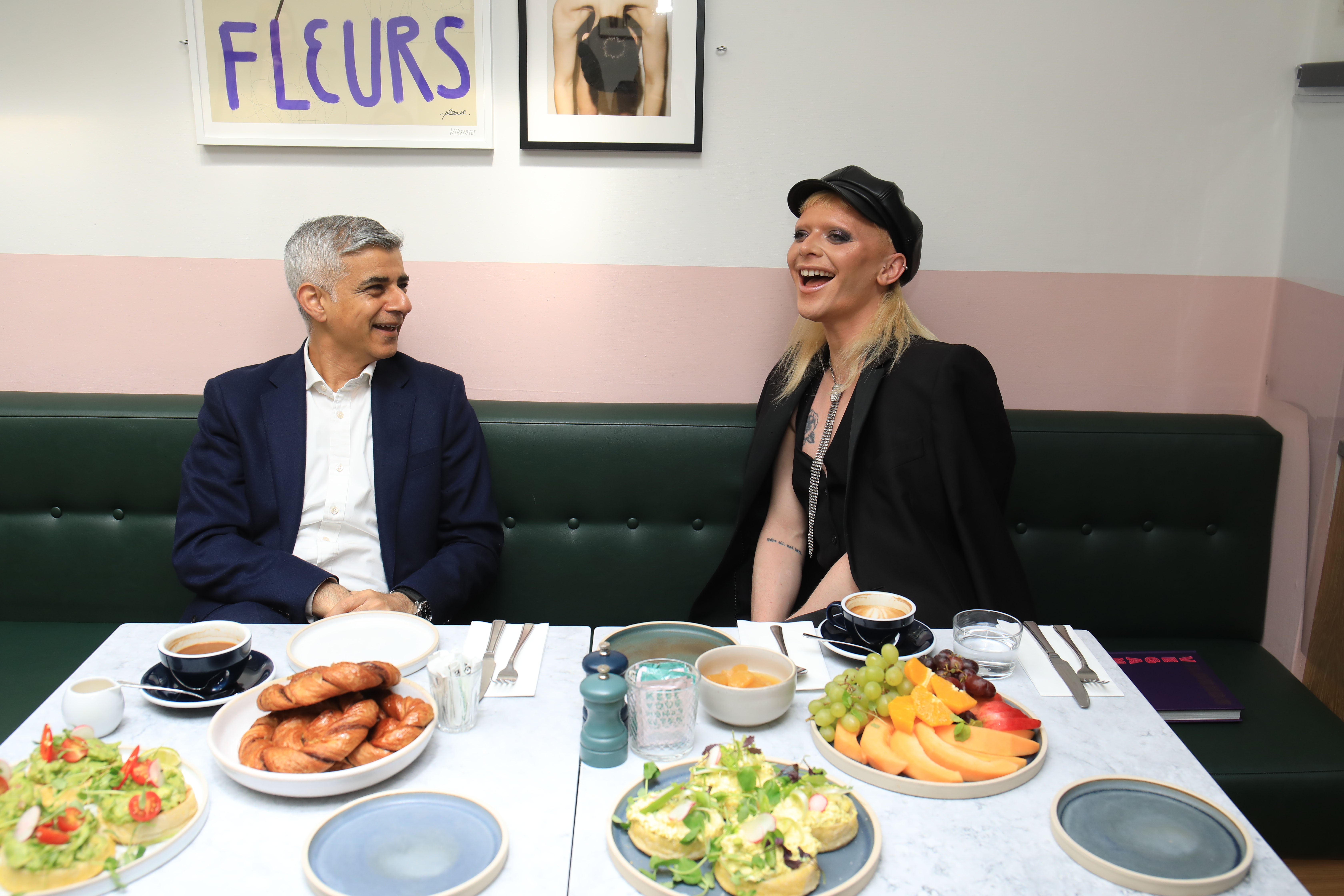 As restaurants across England open for indoor dining today, Sadiq Khan enjoys a bite to eat inside vegan restaurant Mildreds in Soho, central London, joined by East-London based drag queen Bimini Bon-Boulash