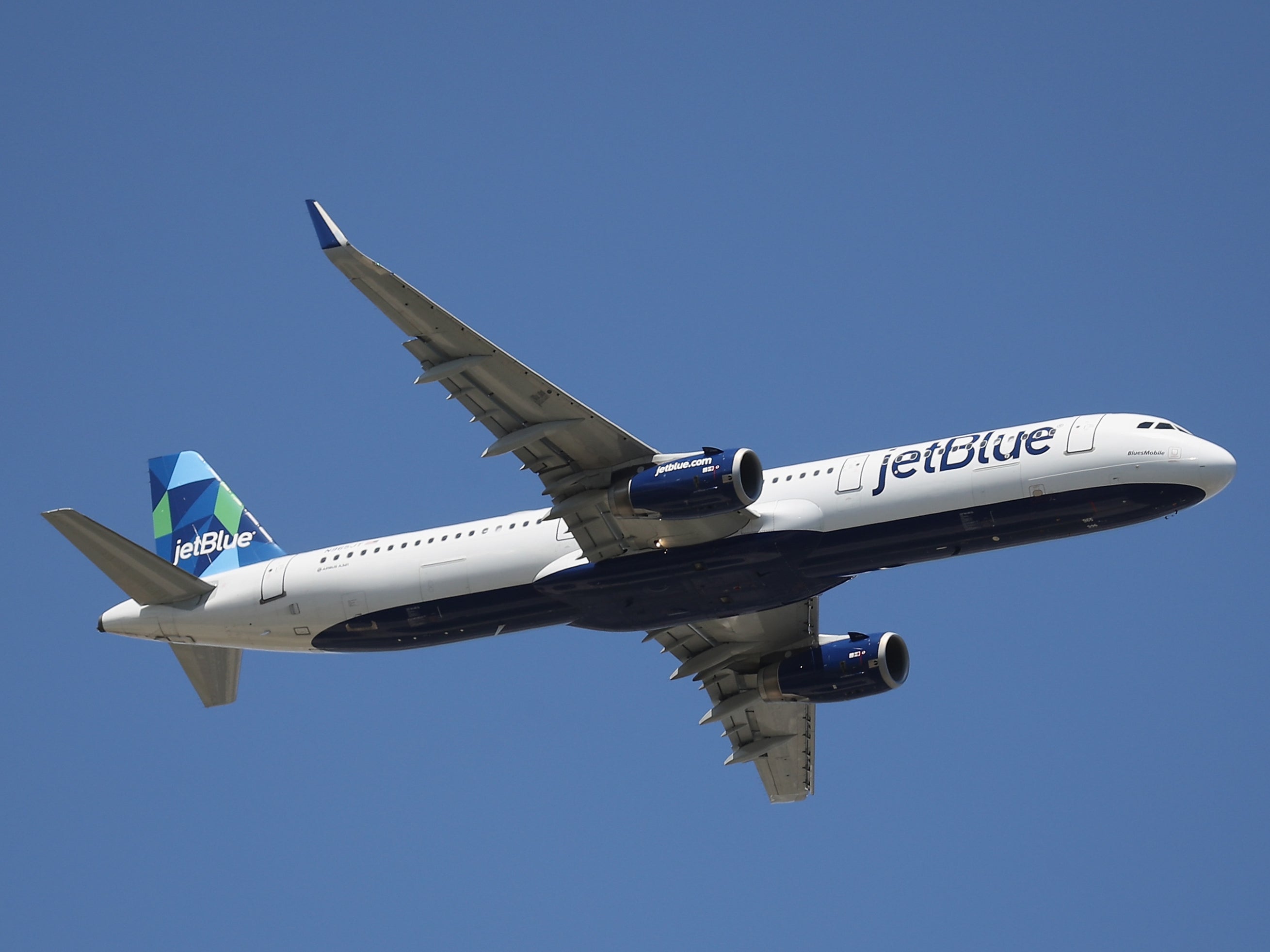 The JetBlue flight was preparing to take off down the runway when it almost crossed path with another flight