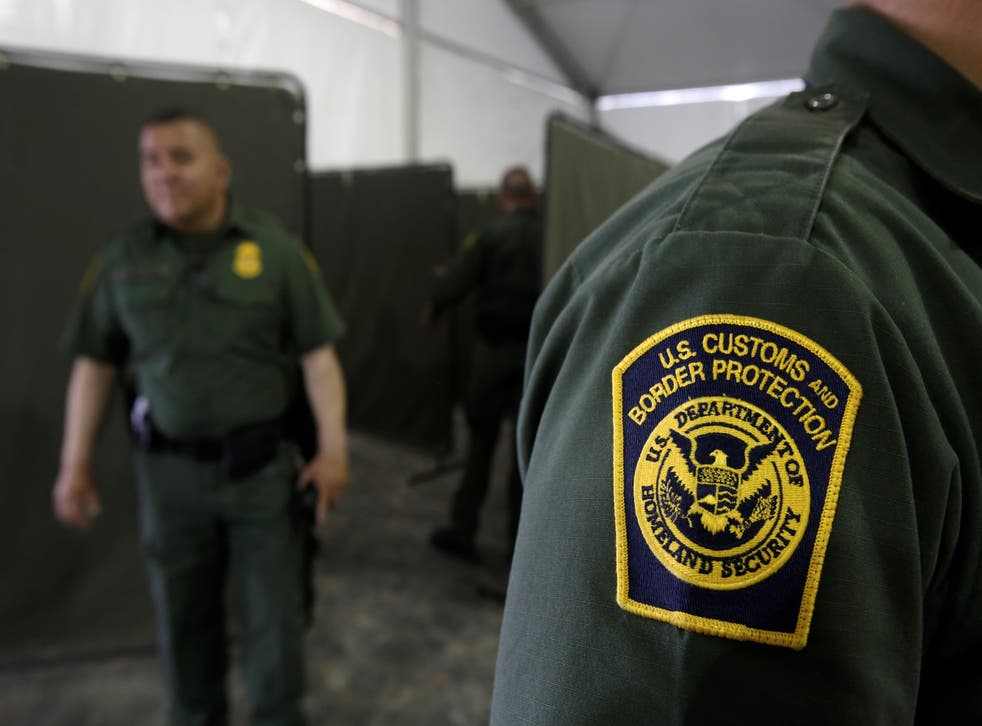 US Border Patrol agents are seen during a tour of US Customs and Border Protection (CBP) temporary holding facilities in El Paso, Texas, in May 2019