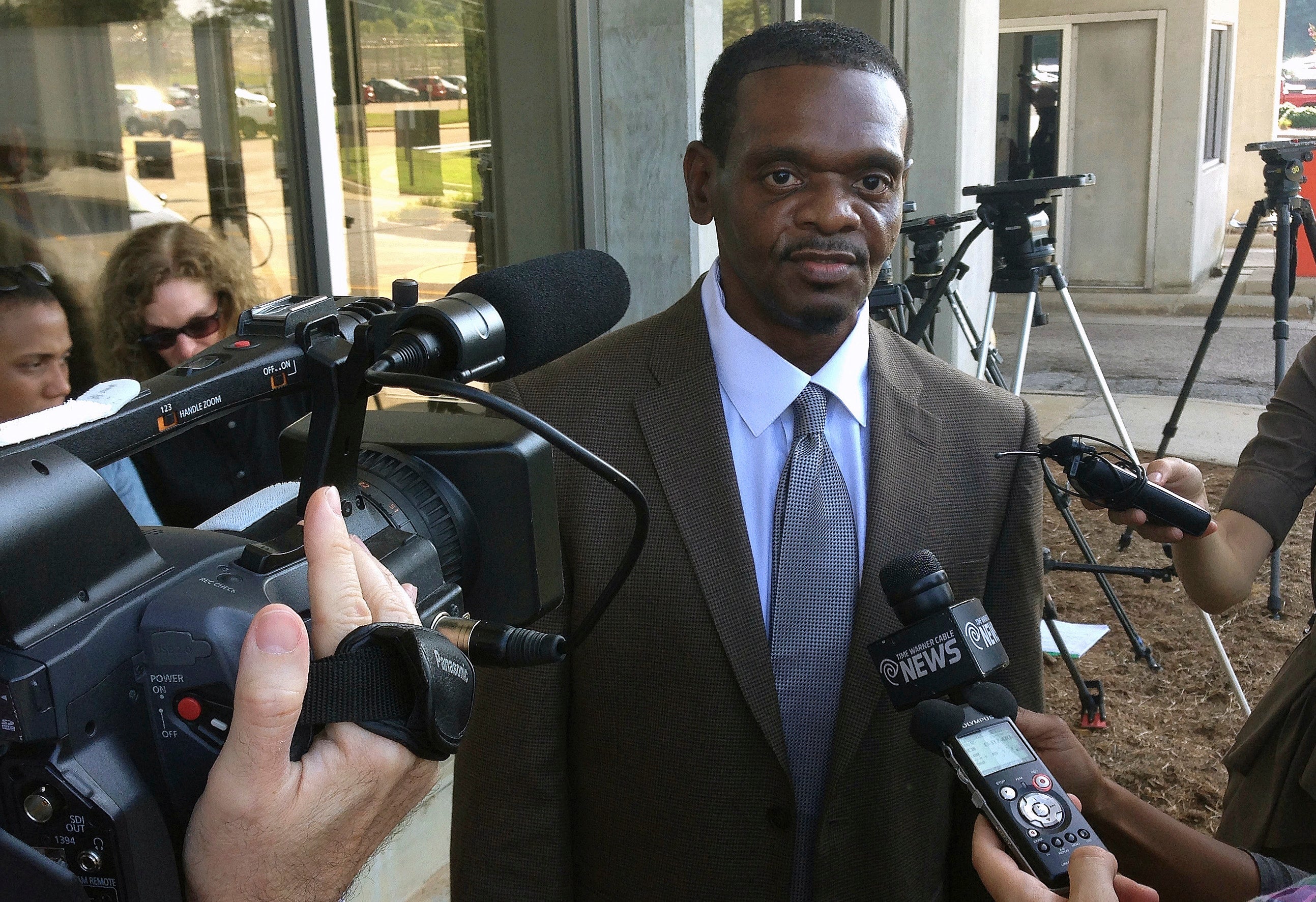 <p>Henry McCollum walks out of prison after being released from Central Prison in Raleigh on 3 September, 2014.</p>