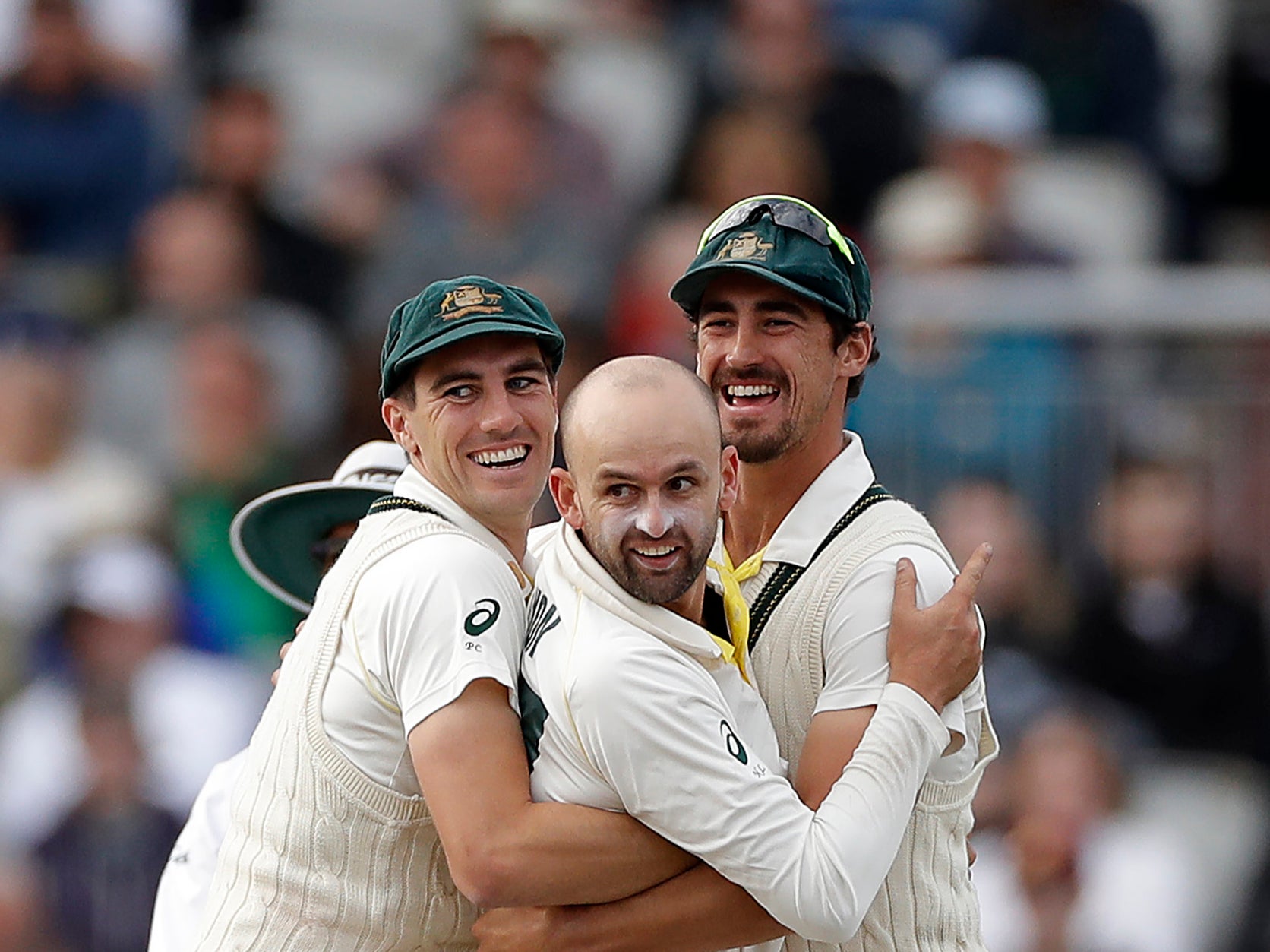 Australia bowlers Pat Cummins, Nathan Lyon and Mitchell Starc (L-R) celebrate