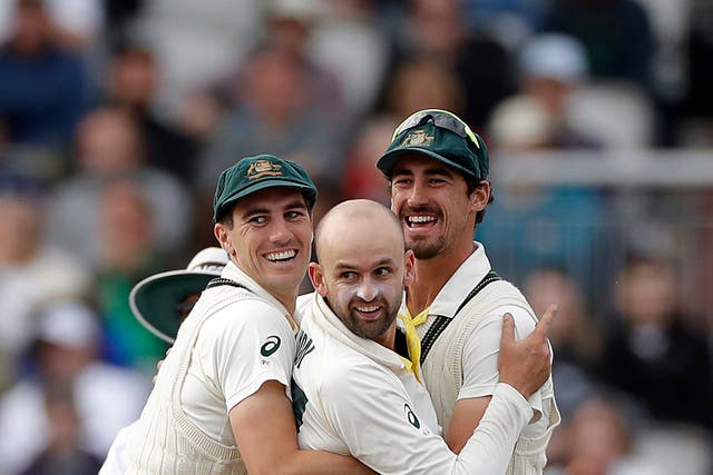 Australia bowlers Pat Cummins, Nathan Lyon and Mitchell Starc (L-R) celebrate