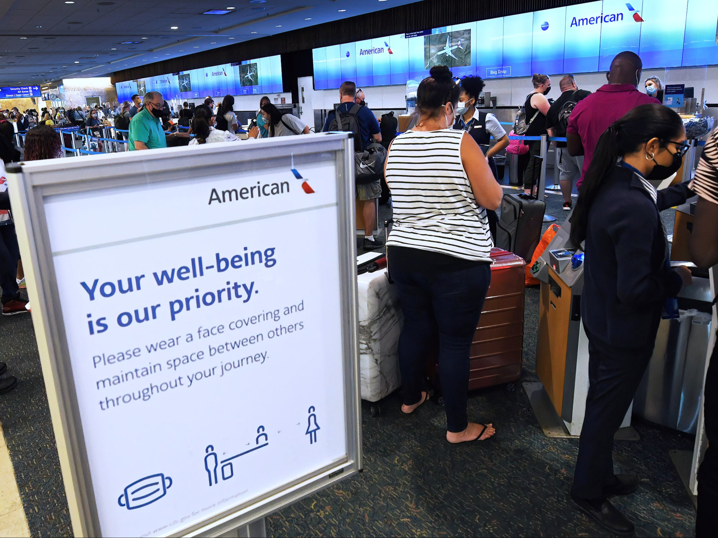 Passengers waiting in line for an American Airlines flight