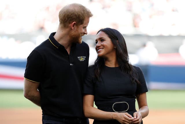 <p>Prince Harry, Duke of Sussex and Meghan, Duchess of Sussex attend the Boston Red Sox vs New York Yankees baseball game at London Stadium</p>