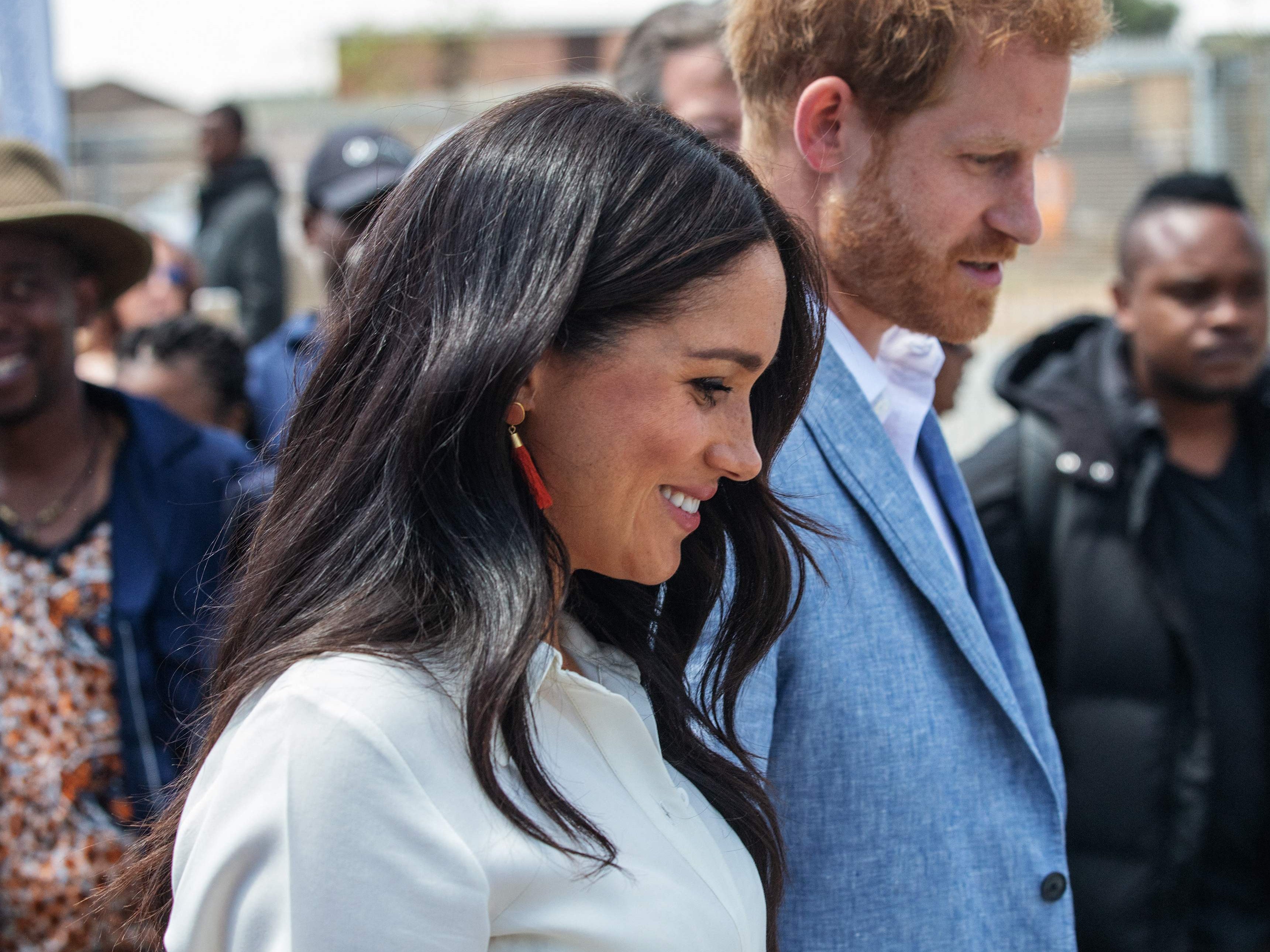 Prince Harry and Meghan leave the Youth Employment Services Hub in Tembisa township, Johannesburg