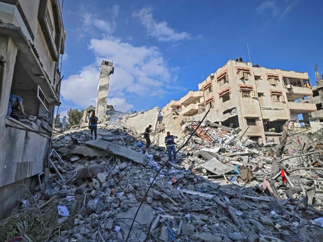 <p>A six-storey building in Gaza City after it was destroyed in an Israeli airstrike</p>