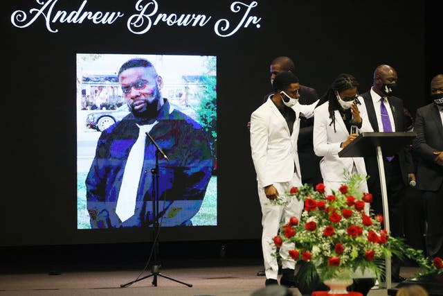 <p>ELIZABETH CITY, NORTH CAROLINA - MAY 03: Jha'rod Ferebee (L) and Khalil Ferebee speak during the funeral for their father Andrew Brown Jr. at the Fountain of Life church on May 03, 2021 in Elizabeth City, North Carolina. Mr. Brown was shot to death by Pasquotank County Sheriff's deputies on April 21.  </p>
