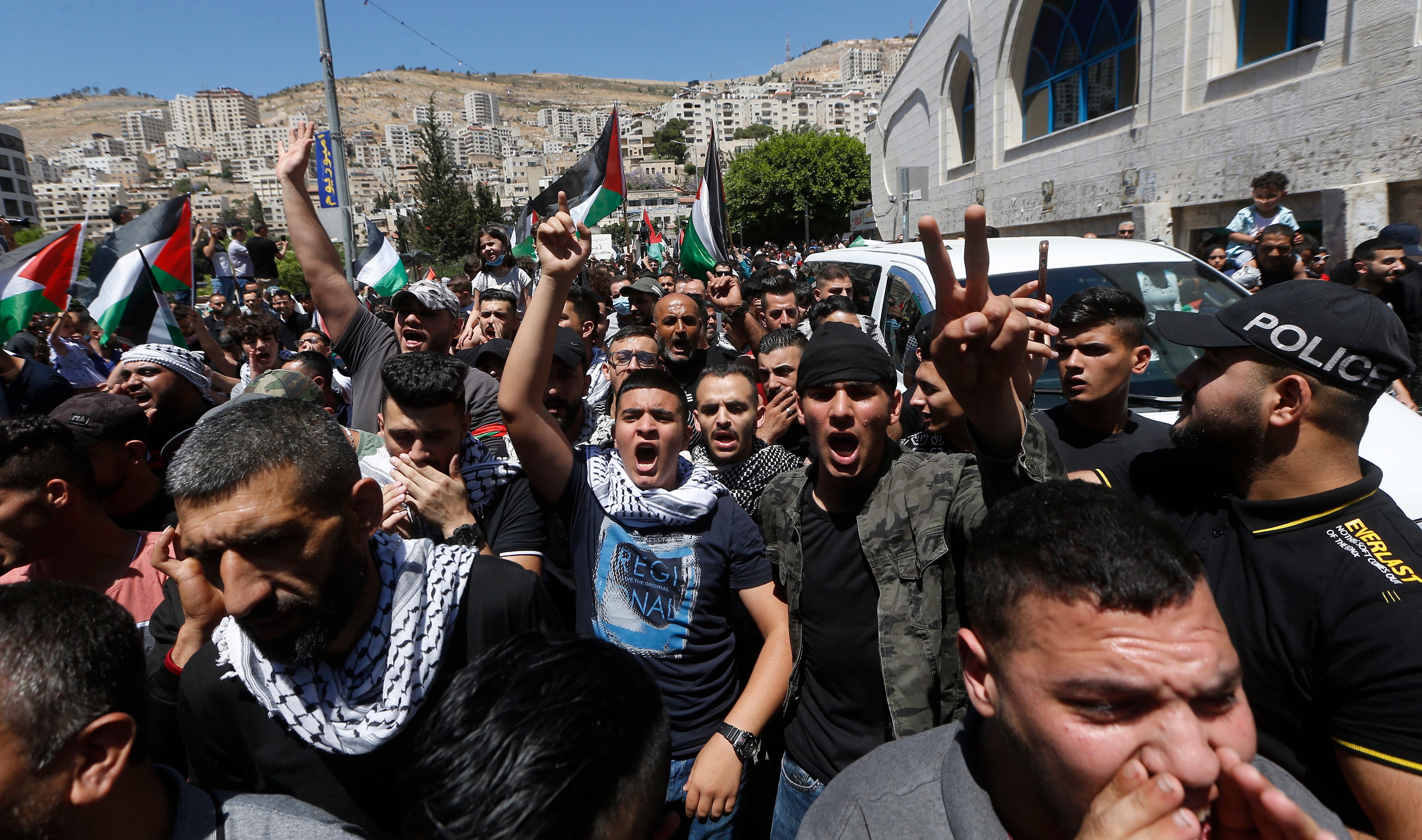 Palestinian protesters shout slogans against Israel during a rally to support Gaza in the West Bank City of Nablus