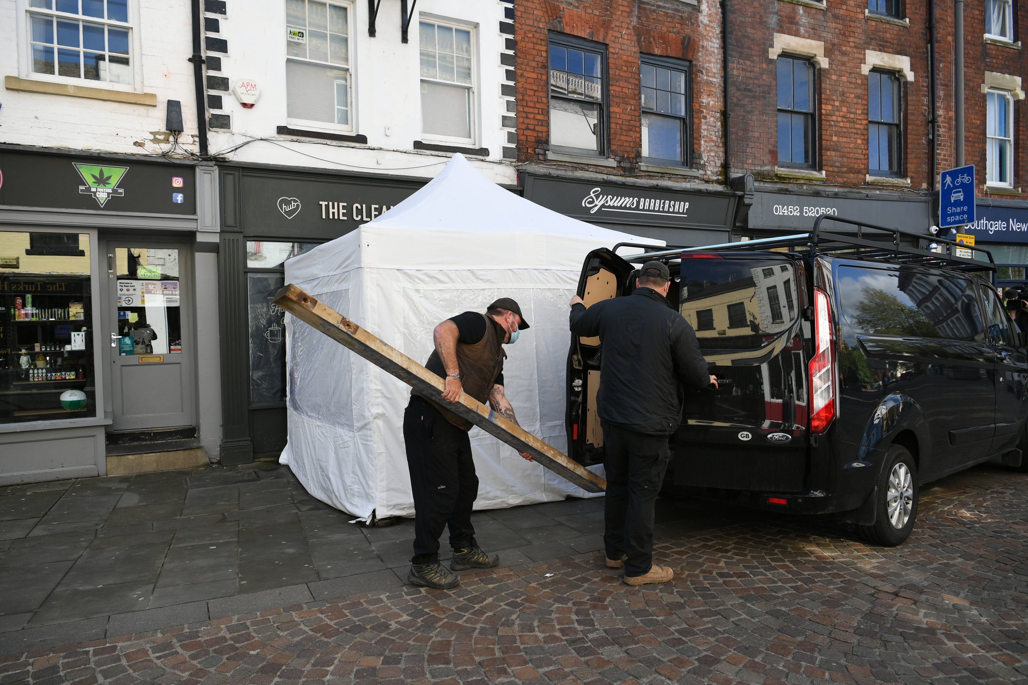 Contractors arriving at The Clean Plate cafe in Southgate Street on Wednesday