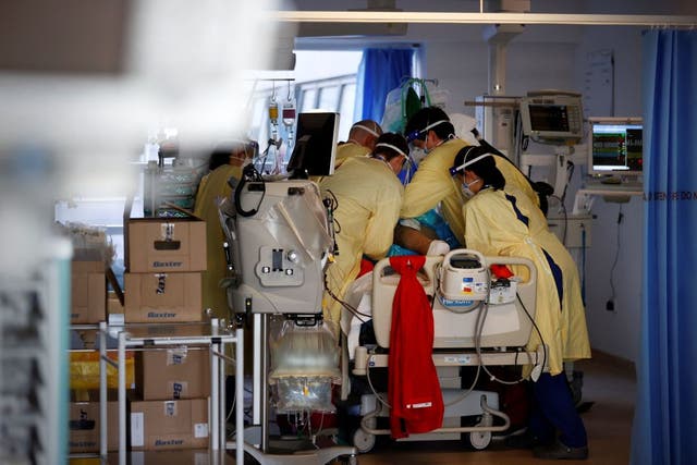 <p>Emergency staff help prone a Covid-19 patient in the Intensive Care Unit at Queen Alexandra Hospital in Portsmouth, on 23 March, 2021</p>