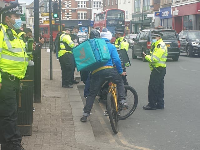 Police in Tooting stop food delivery cyclists