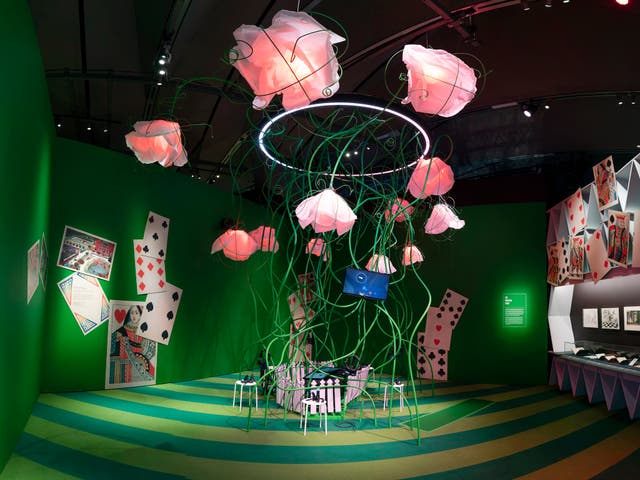 <p>There’s a giant toppling house of cards, a gargantuan caterpillar on stilts and Bridget Riley-style wallpaper on display</p>