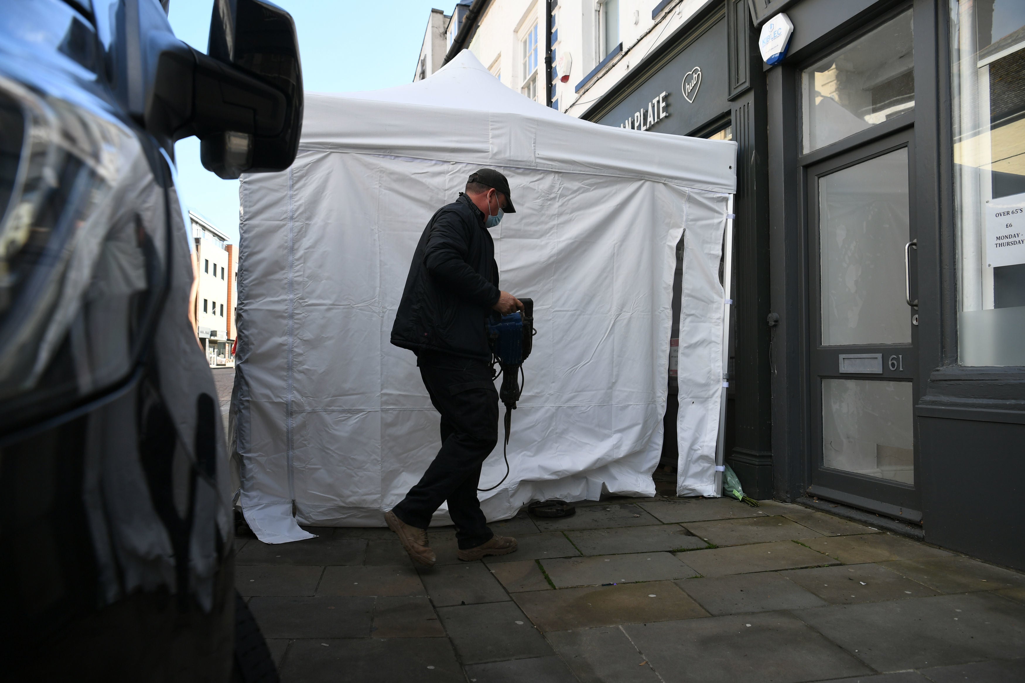 Contractors arriving at The Clean Plate cafe in Southgate Street, Gloucester